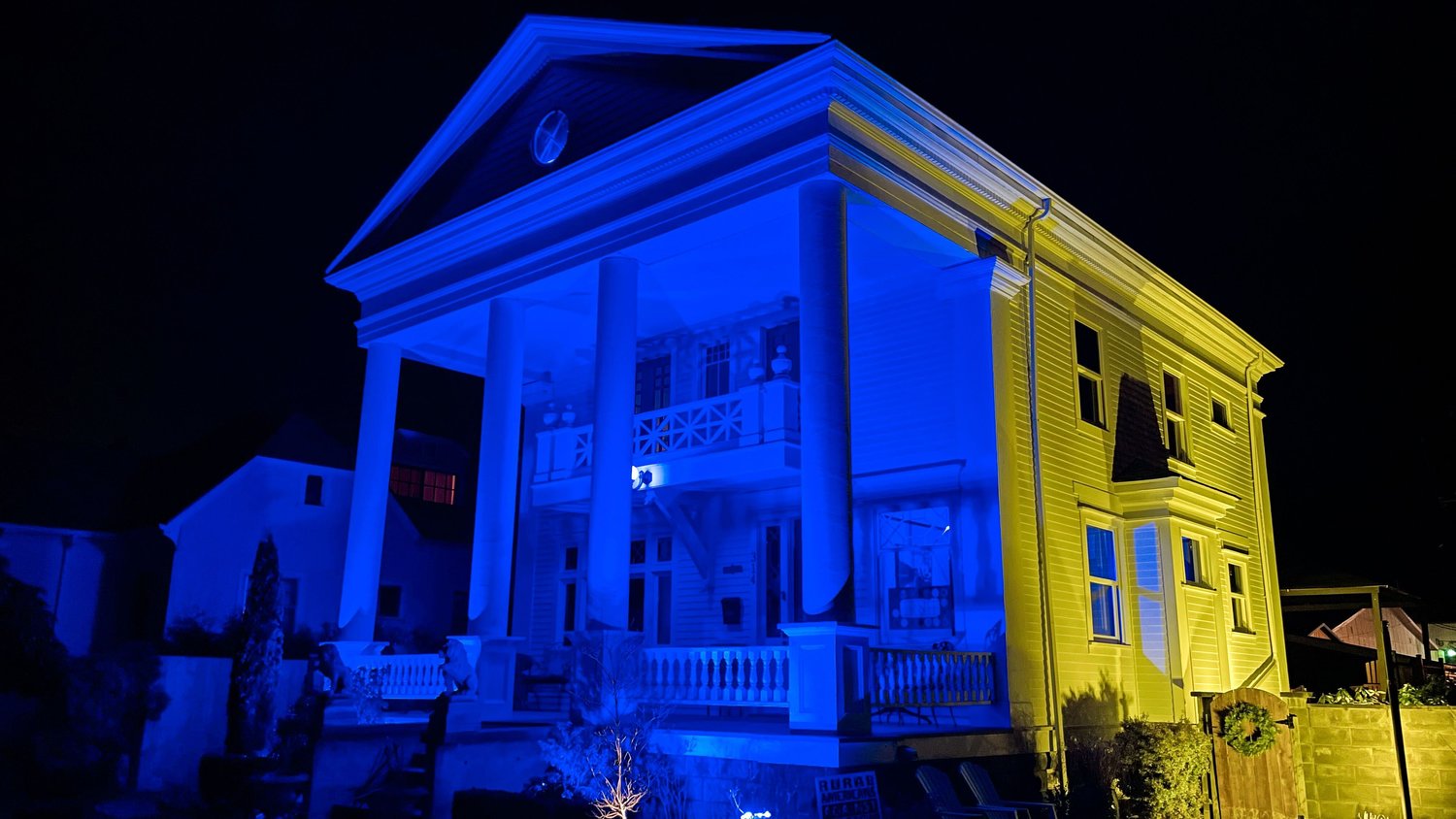 A house in the Edison District is seen illuminated in the colors of the Ukrainian national flag Tuesday night in Centralia.